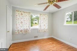 5729 Nevada St, Berwyn Heights, MD 20740 - empty room with baseboards, ceiling fan, and wood finished floors