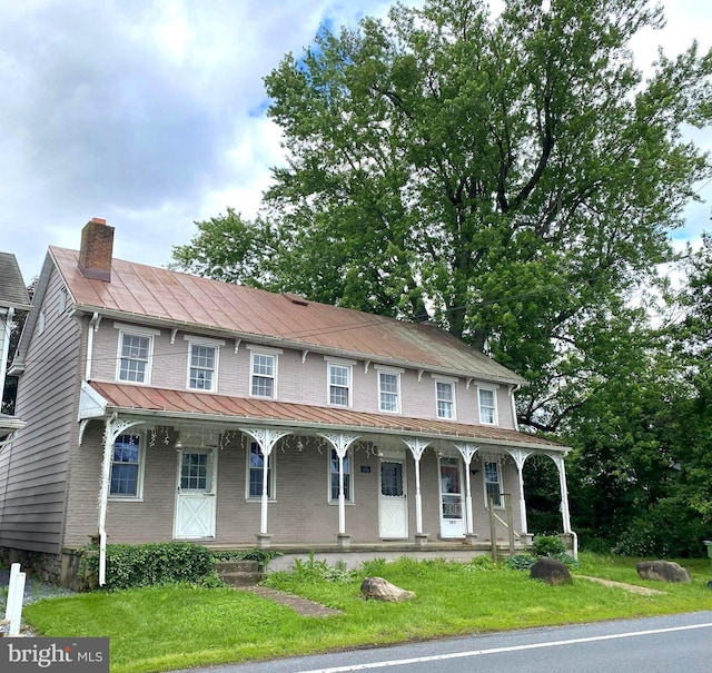 7097 Union Deposit Rd, Hummelstown, PA 17036 - view of front of house featuring covered porch, a chimney, and a front lawn
