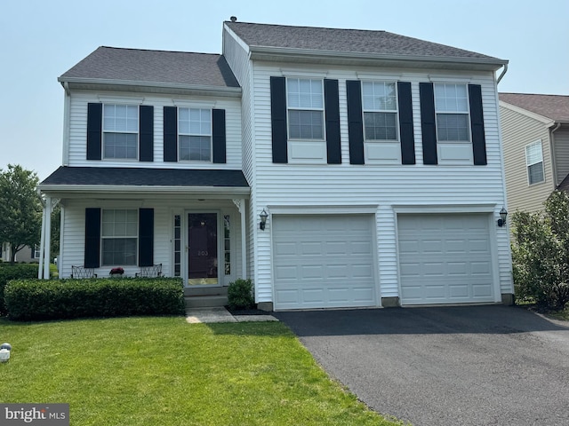 803 Red Coat Rd, Collegeville, PA 19426 - view of front of property with driveway, a front yard, an attached garage, and covered porch