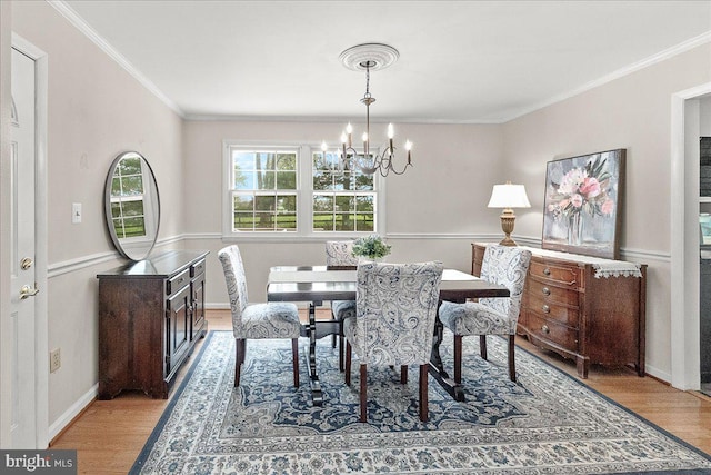 3498 Augusta Dr, Ijamsville, MD 21754 - dining space featuring a chandelier, wood finished floors, and crown molding