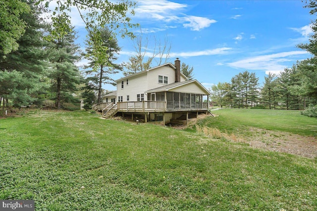 3498 Augusta Dr, Ijamsville, MD 21754 - rear view of property with a sunroom, a chimney, a lawn, and a deck