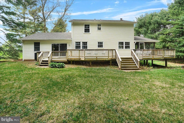 3498 Augusta Dr, Ijamsville, MD 21754 - rear view of house with a deck, a sunroom, and a yard