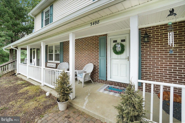 3498 Augusta Dr, Ijamsville, MD 21754 - property entrance featuring a porch and brick siding