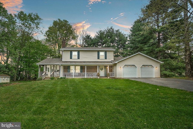 3498 Augusta Dr, Ijamsville, MD 21754 - view of front facade with an attached garage, a porch, driveway, a chimney, and a front lawn