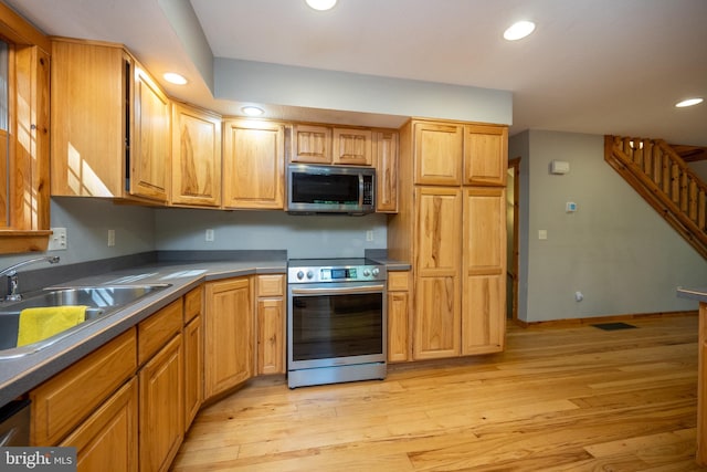 129 Bucks Crossing Ln, Accident, MD 21520 - kitchen with appliances with stainless steel finishes, recessed lighting, light wood-style flooring, and dark countertops