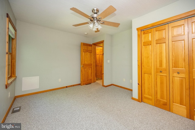 129 Bucks Crossing Ln, Accident, MD 21520 - unfurnished bedroom with carpet flooring, a closet, and ceiling fan