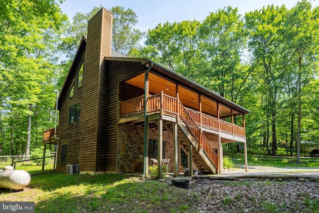 129 Bucks Crossing Ln, Accident, MD 21520 - back of property featuring a chimney, stairs, and a deck