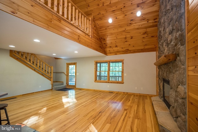 129 Bucks Crossing Ln, Accident, MD 21520 - unfurnished living room featuring stairway, wood finished floors, recessed lighting, wooden ceiling, and a stone fireplace