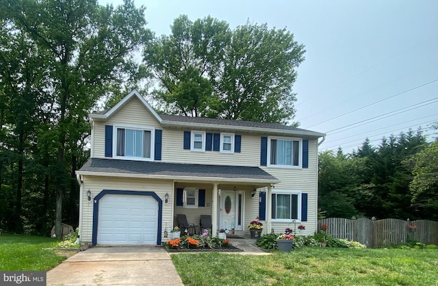 7738 Monaghan Rd, Glen Burnie, MD 21060 - traditional-style house with a garage, driveway, and covered porch