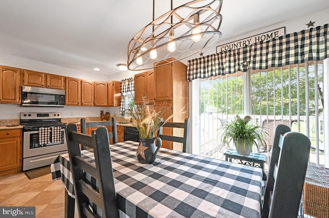 11684 Kensington Way, Laurel, DE 19956 - dining area featuring healthy amount of natural light, a chandelier, recessed lighting, and light tile patterned floors