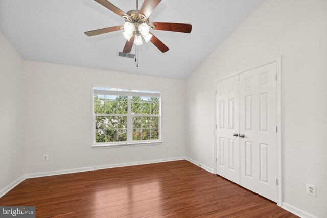2441 Wheat Meadow Cir, Herndon, VA 20171 - unfurnished bedroom featuring lofted ceiling, wood finished floors, a closet, and a ceiling fan