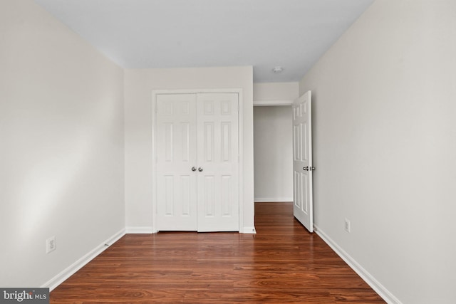 2441 Wheat Meadow Cir, Herndon, VA 20171 - unfurnished bedroom featuring wood finished floors and a closet