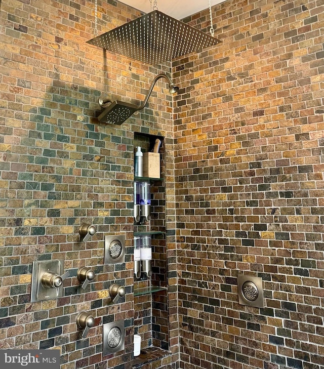 712 E Seminary Ave E, Towson, MD 21286 - bathroom view of a tile shower, brick wall, and electric meter