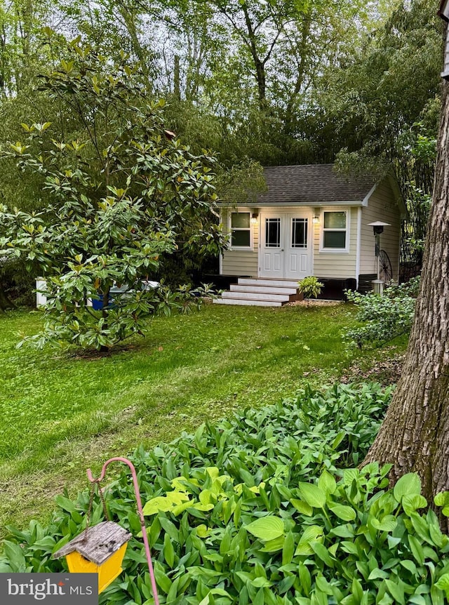 712 E Seminary Ave E, Towson, MD 21286 - view of front of house with a shingled roof and an outbuilding