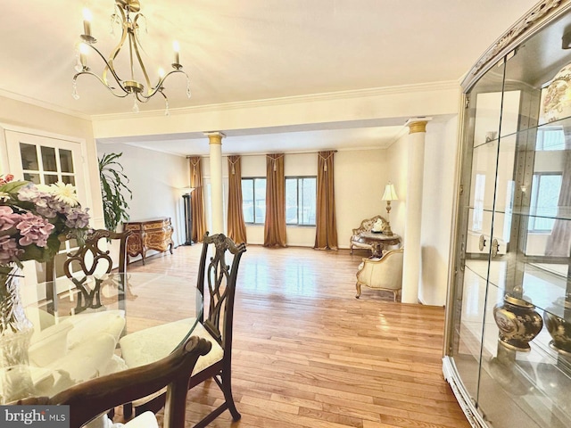 1249 Birchcrest Ct, Arnold, MD 21012 - dining area featuring ornate columns, ornamental molding, light wood-type flooring, and a chandelier