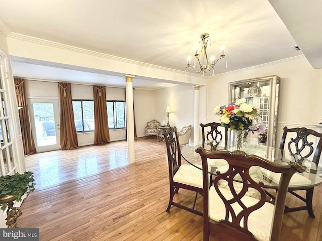 1249 Birchcrest Ct, Arnold, MD 21012 - dining area featuring light wood-type flooring, a chandelier, ornamental molding, and decorative columns