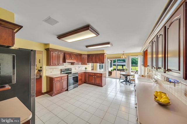 284 Little New York Rd, Rising Sun, MD 21911 - kitchen with appliances with stainless steel finishes, decorative backsplash, light countertops, and light tile patterned floors