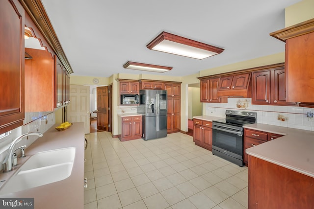 284 Little New York Rd, Rising Sun, MD 21911 - kitchen featuring stainless steel appliances, tasteful backsplash, light countertops, and light tile patterned floors