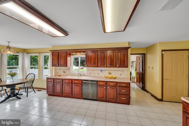 284 Little New York Rd, Rising Sun, MD 21911 - kitchen with stainless steel dishwasher, light countertops, tasteful backsplash, and light tile patterned floors