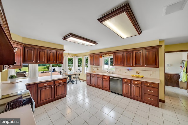284 Little New York Rd, Rising Sun, MD 21911 - kitchen featuring stainless steel appliances, light countertops, light tile patterned floors, a wainscoted wall, and decorative backsplash