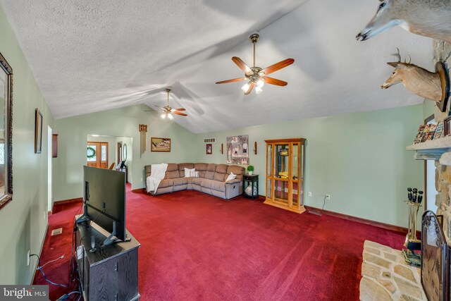 284 Little New York Rd, Rising Sun, MD 21911 - living room featuring lofted ceiling, carpet floors, ceiling fan, and a stone fireplace