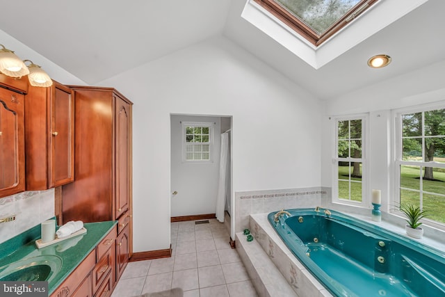 284 Little New York Rd, Rising Sun, MD 21911 - bathroom with a skylight, lofted ceiling, a tub with jets, healthy amount of natural light, and tile patterned flooring