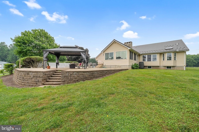 284 Little New York Rd, Rising Sun, MD 21911 - back of property with a gazebo, a patio area, a yard, a chimney, and a metal roof