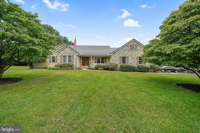 284 Little New York Rd, Rising Sun, MD 21911 - ranch-style house featuring stone siding, a front yard, a metal roof, and a standing seam roof