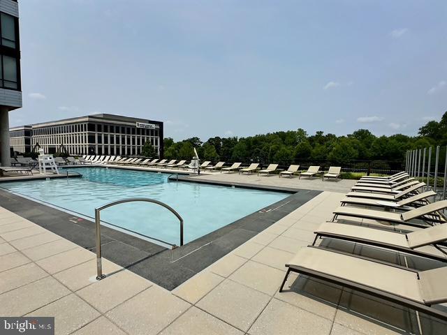 145 Riverhaven Dr Unit 254, Oxon Hill, MD 20745 - community pool featuring a patio area