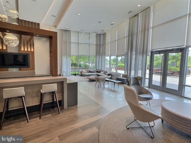 145 Riverhaven Dr Unit 254, Oxon Hill, MD 20745 - common area featuring a high ceiling, a wall of windows, and recessed lighting