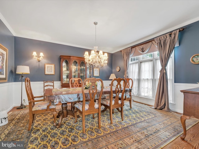 3002 Ridgeview Dr, Orwigsburg, PA 17961 - dining room with a chandelier, a wainscoted wall, and crown molding