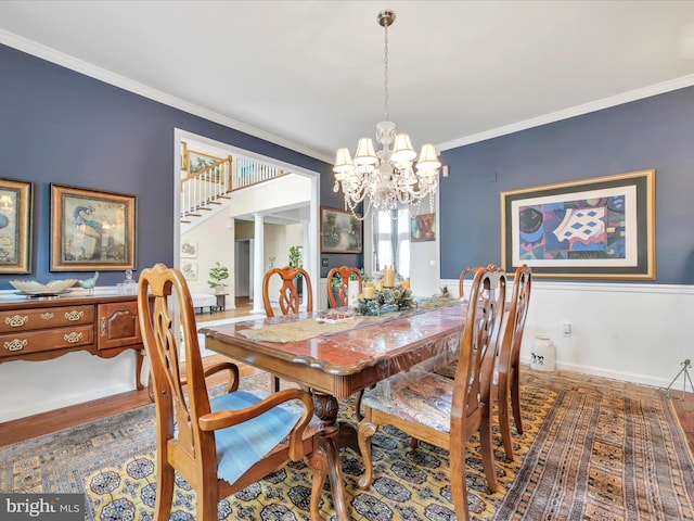 3002 Ridgeview Dr, Orwigsburg, PA 17961 - dining area featuring crown molding, a chandelier, stairs, and wood finished floors