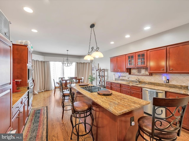 3002 Ridgeview Dr, Orwigsburg, PA 17961 - kitchen with stainless steel appliances, light wood-type flooring, light stone counters, tasteful backsplash, and recessed lighting