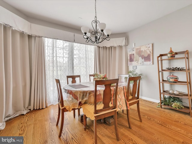 3002 Ridgeview Dr, Orwigsburg, PA 17961 - dining space with a chandelier, light wood finished floors, and baseboards