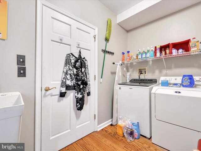 3002 Ridgeview Dr, Orwigsburg, PA 17961 - laundry area with separate washer and dryer, light wood-style flooring, and baseboards