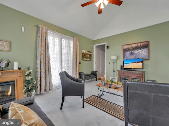 3002 Ridgeview Dr, Orwigsburg, PA 17961 - carpeted living area featuring vaulted ceiling, a ceiling fan, and a glass covered fireplace