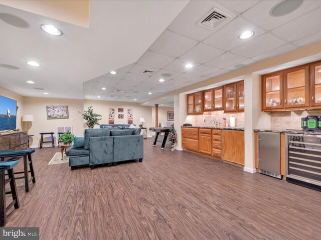 3002 Ridgeview Dr, Orwigsburg, PA 17961 - living room with dark wood-type flooring, beverage cooler, wet bar, baseboards, and recessed lighting