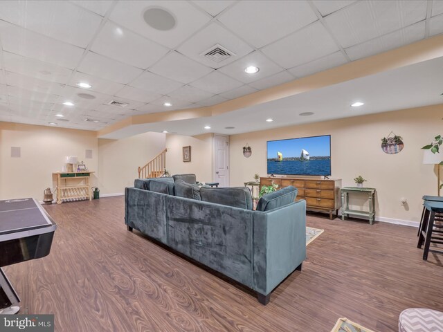 3002 Ridgeview Dr, Orwigsburg, PA 17961 - living area featuring stairway, dark wood-style flooring, baseboards, a paneled ceiling, and recessed lighting