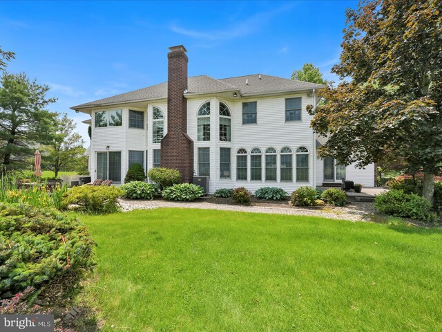 3002 Ridgeview Dr, Orwigsburg, PA 17961 - rear view of property featuring a chimney, a lawn, and a shingled roof