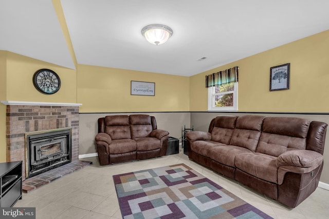 38390 Golden Beach Rd, Mechanicsville, MD 20659 - living room featuring light tile patterned floors, baseboards, and a brick fireplace