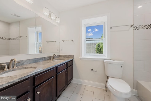148 S E Ave, Baltimore, MD 21224 - bathroom with double vanity, tile patterned floors, toilet, and baseboards