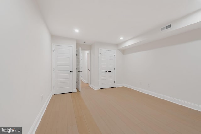 148 S E Ave, Baltimore, MD 21224 - below grade area with baseboards, light wood finished floors, and recessed lighting