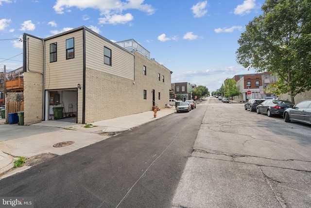 148 S E Ave, Baltimore, MD 21224 - view of asphalt street with sidewalks, a residential view, and curbs