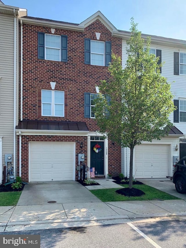 1928 Reading Ct, Mount Airy, MD 21771 - view of property with brick siding, concrete driveway, and a garage