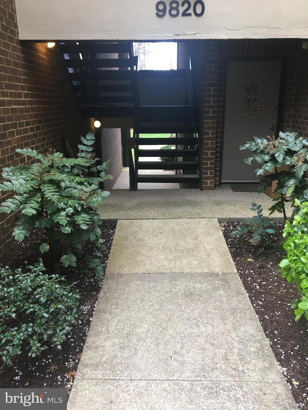 9820 Georgia Ave Unit 21-301, Silver Spring, MD 20902 - view of exterior entry featuring brick siding