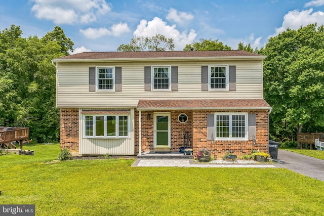 148 Belmont Dr, Upper Chichester, PA 19061 - view of front facade with a front yard and brick siding