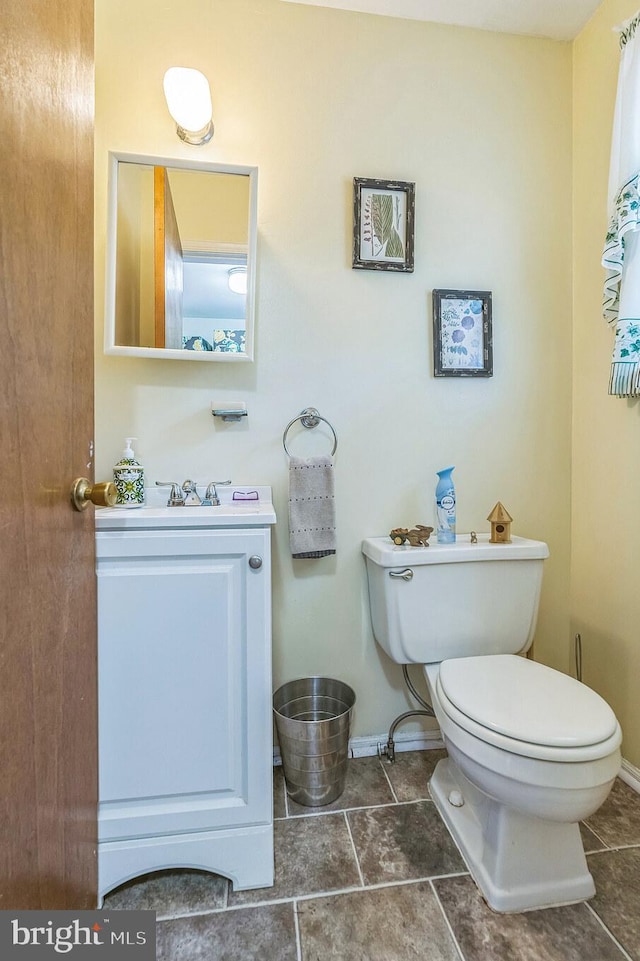 148 Belmont Dr, Upper Chichester, PA 19061 - half bathroom featuring vanity, toilet, baseboards, and tile patterned floors