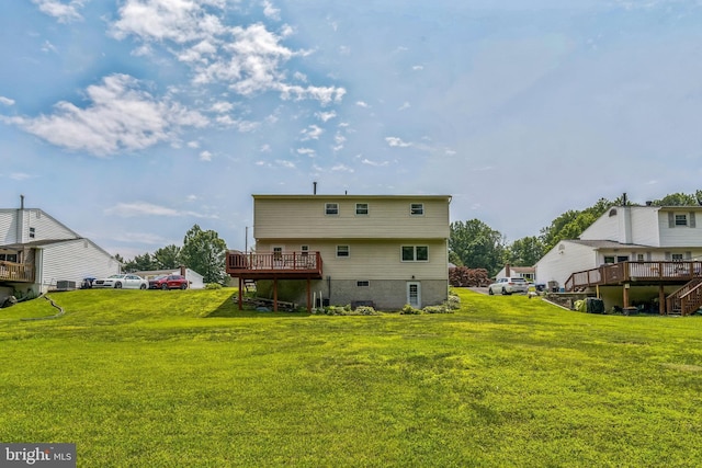 148 Belmont Dr, Upper Chichester, PA 19061 - rear view of property with a deck and a yard