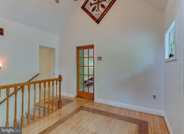 26747 Cat Creek Rd, Mechanicsville, MD 20659 - corridor with an upstairs landing, hardwood / wood-style flooring, baseboards, and high vaulted ceiling