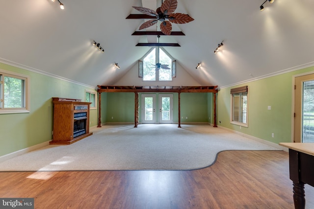 26747 Cat Creek Rd, Mechanicsville, MD 20659 - unfurnished living room featuring track lighting, ceiling fan, wood finished floors, a fireplace, and vaulted ceiling